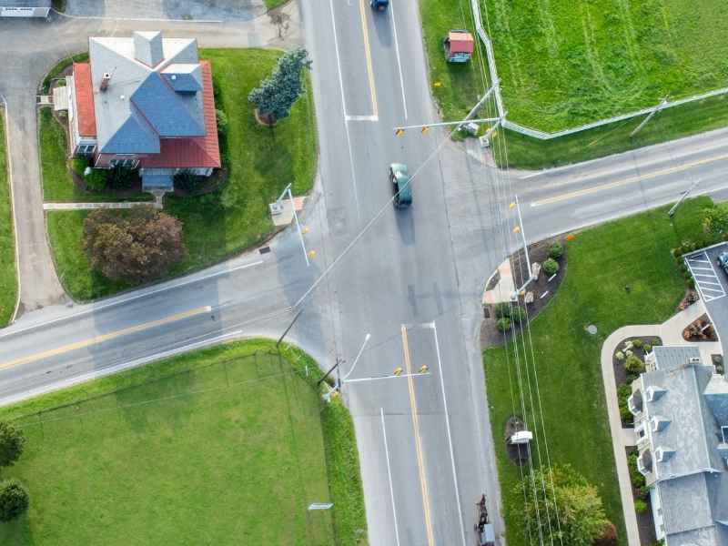 Topographic survey road widening Hoover Alabama | Hoover Land Surveying Aerial view of a roadway intersection with utilities and roadside features for topographic survey road widening planning in Hoover Alabama